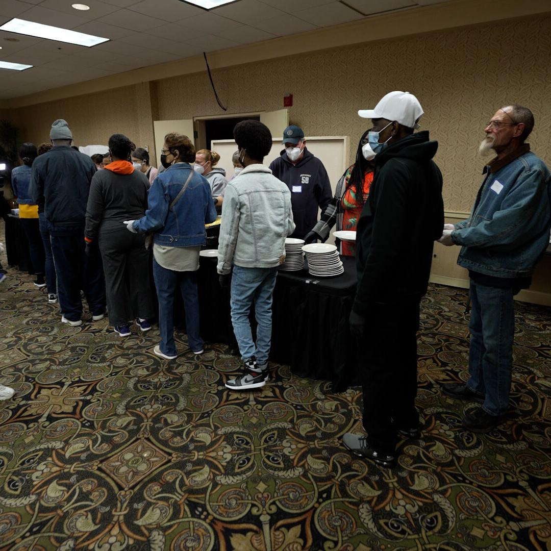 People wait for breakfast at Wayside Christian Mission in Louisville